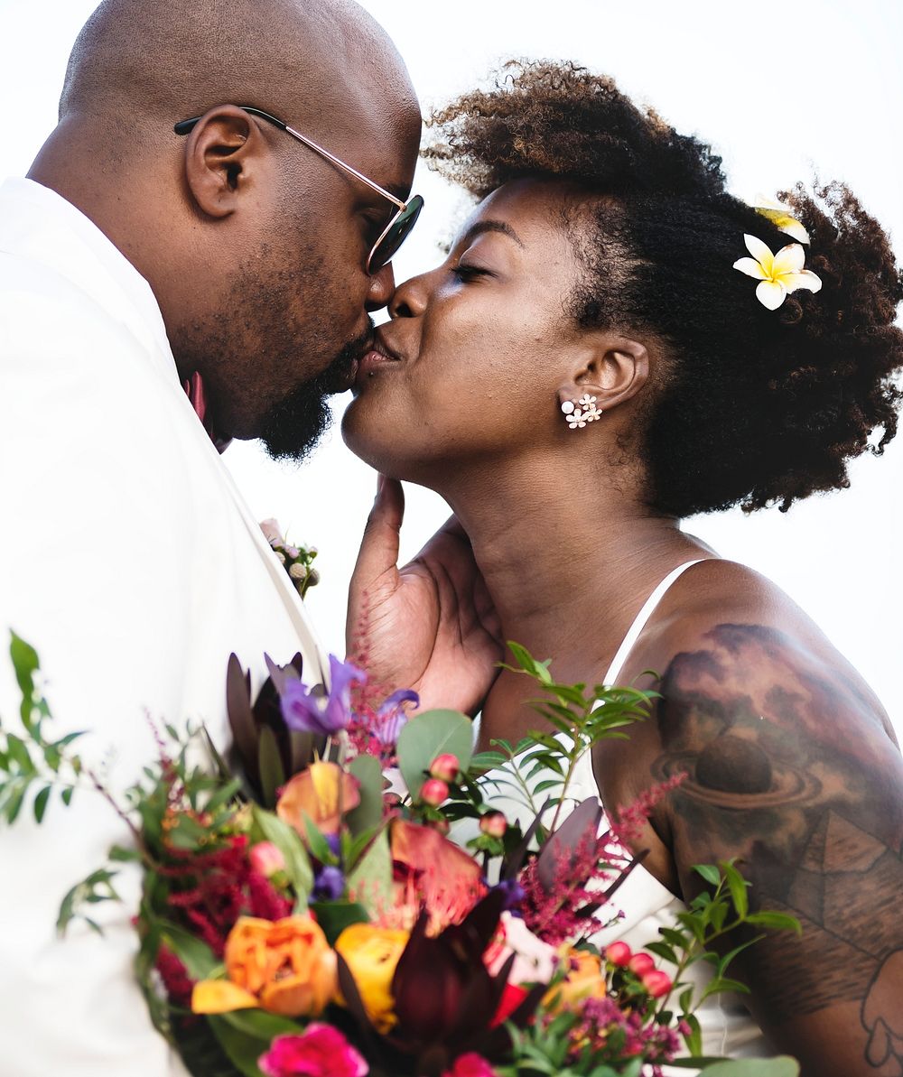 African American couple getting married at an island