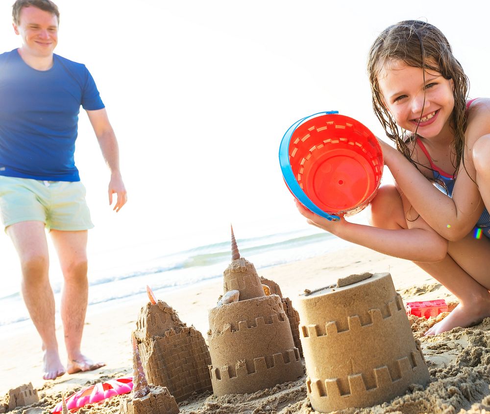 Family building a sand castle