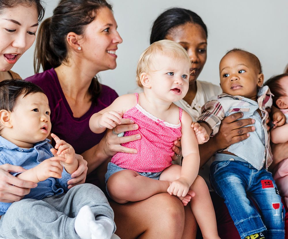 Diverse babies with their parents