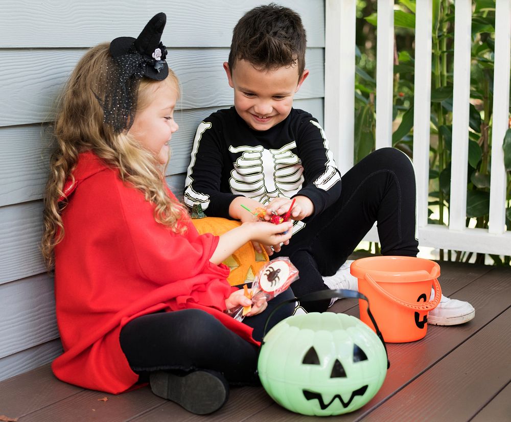 Little children trick or treating on Halloween