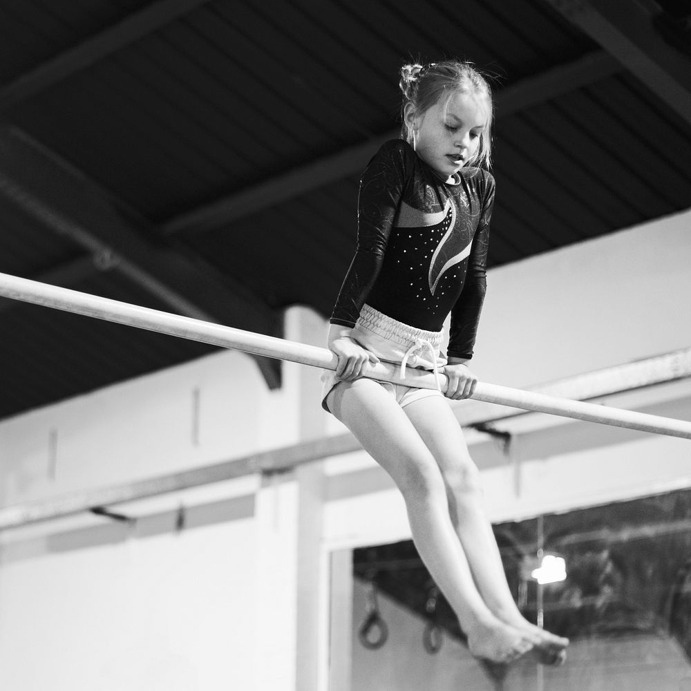 Young gymnast on a horizontal bar
