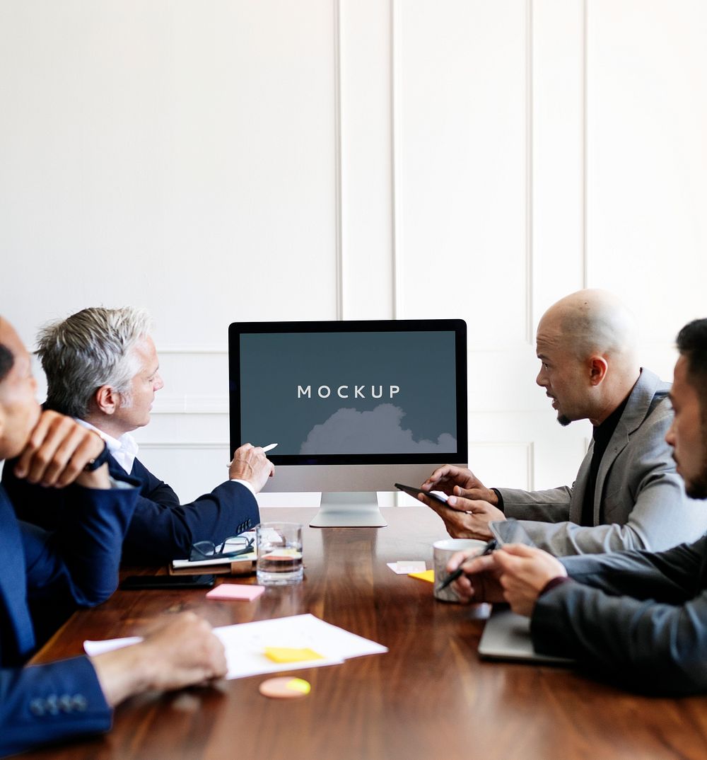 Business people having a conference meeting using a computer screen mockup