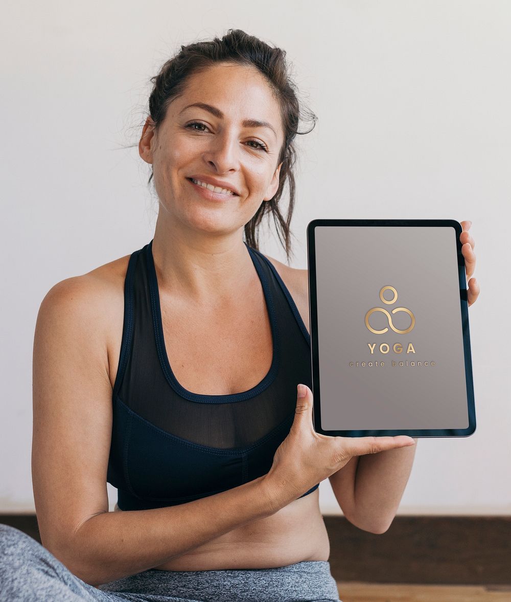 Yoga instructor showing a digital tablet mockup mobile phone wallpaper