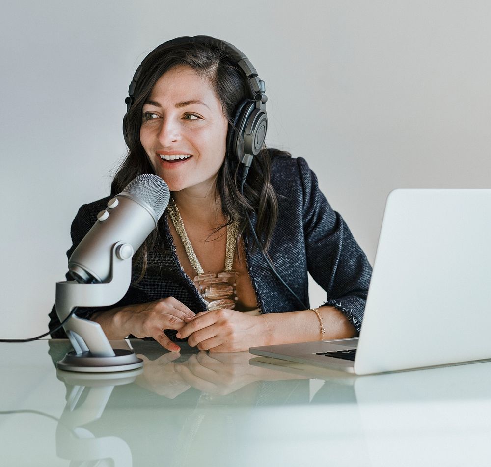 Female radio host broadcasting live in a studio