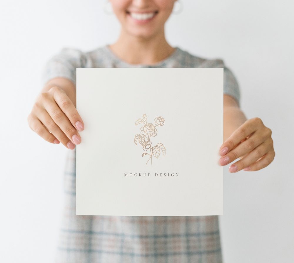 Cheerful woman showing a white card mockup