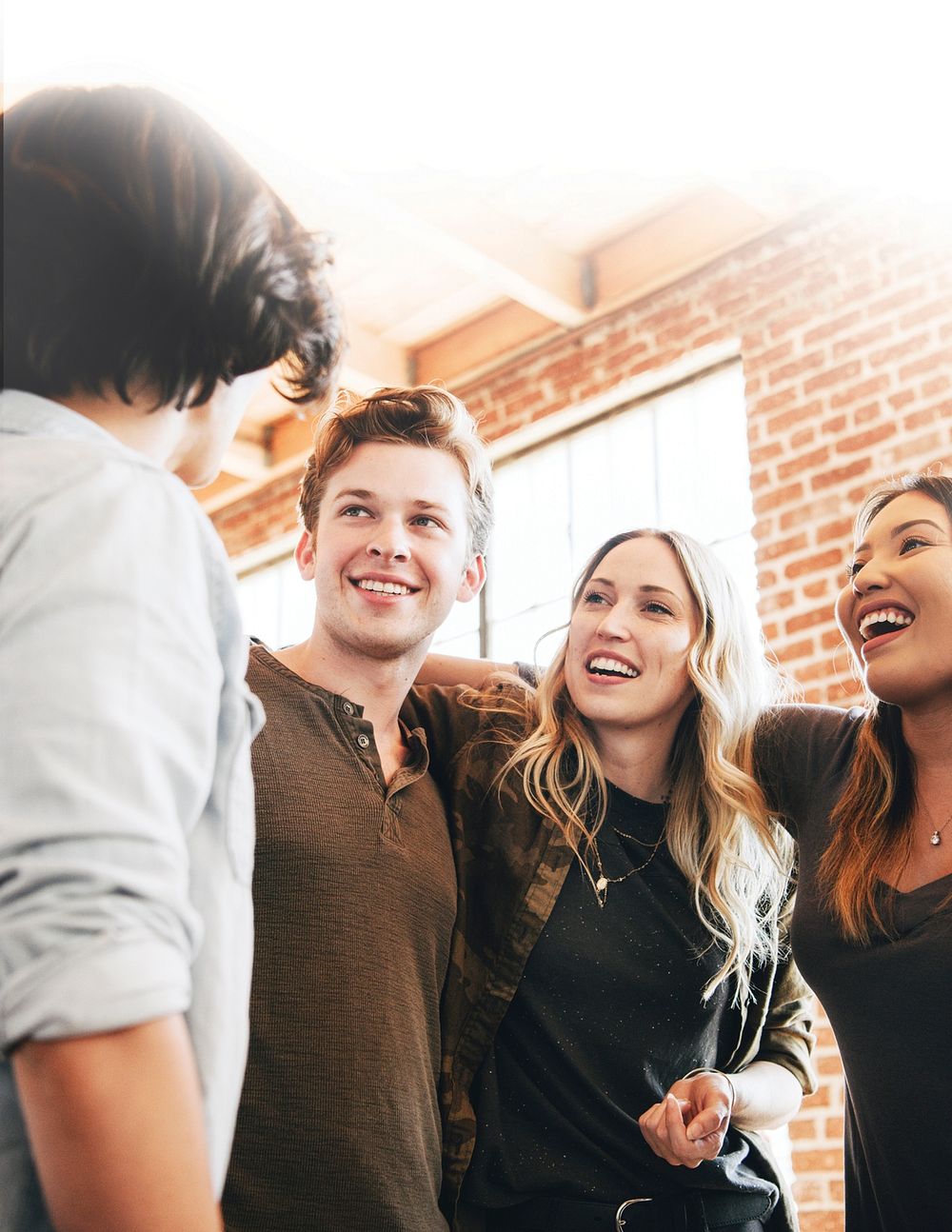 Cheerful diverse people circling together