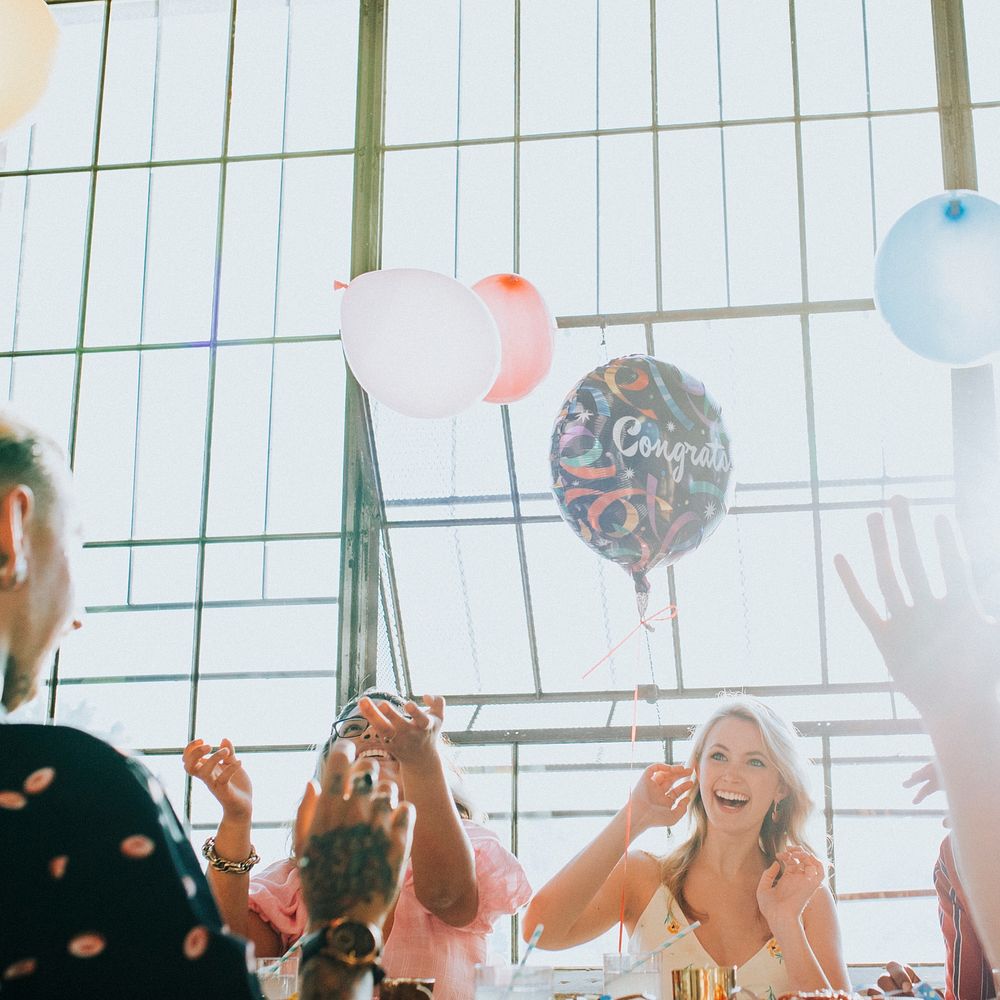 People playing with balloons at a party social ads template