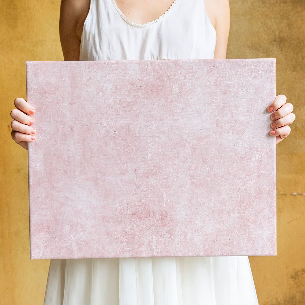 Woman showing a blank canvas mockup