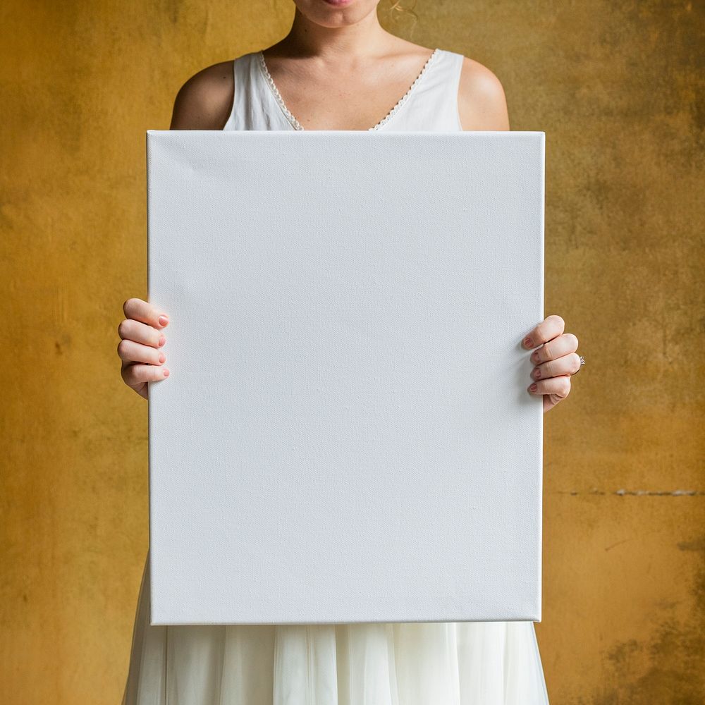 Woman showing a blank canvas mockup