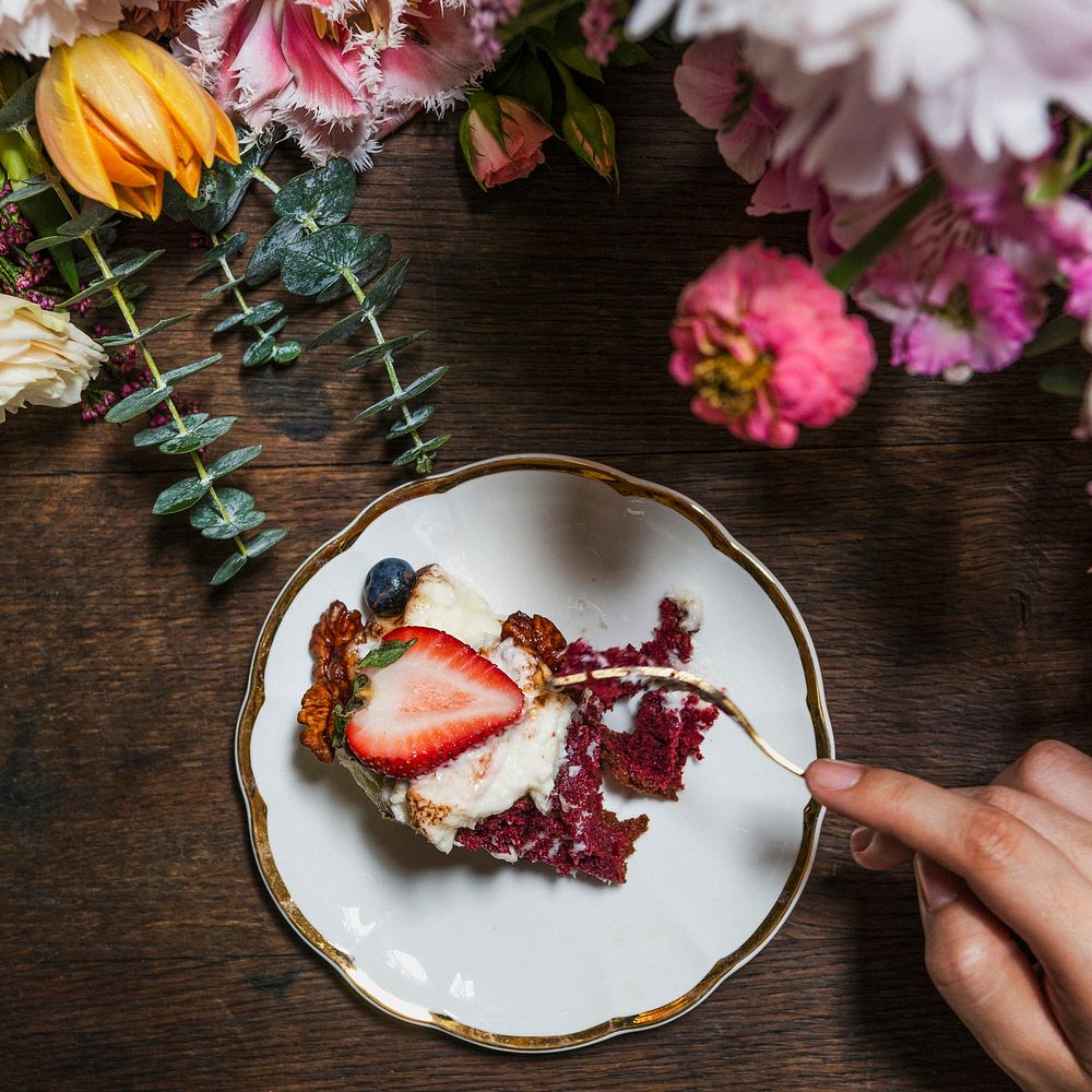 Woman enjoying a slice of strawberry cake