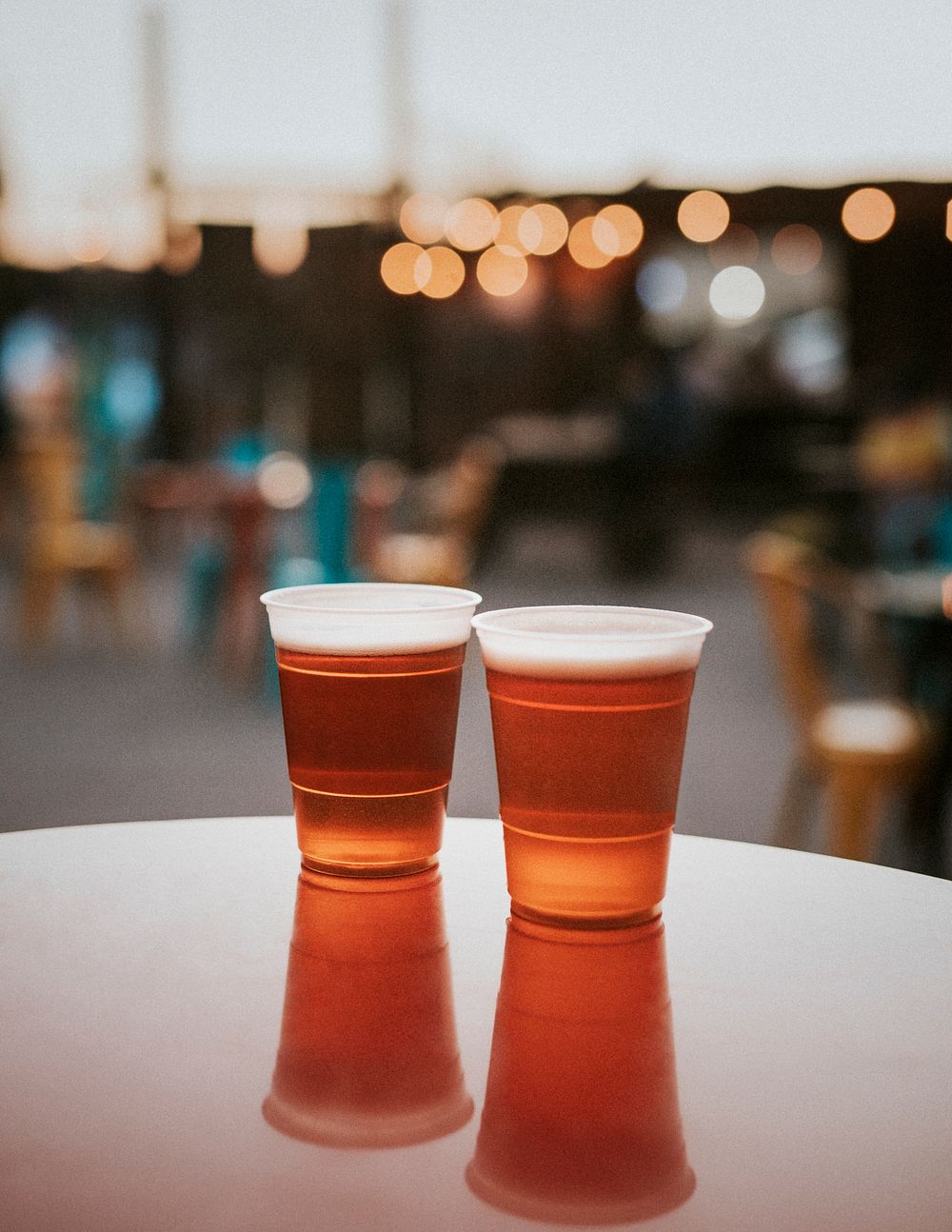 Two plastic cups with beer