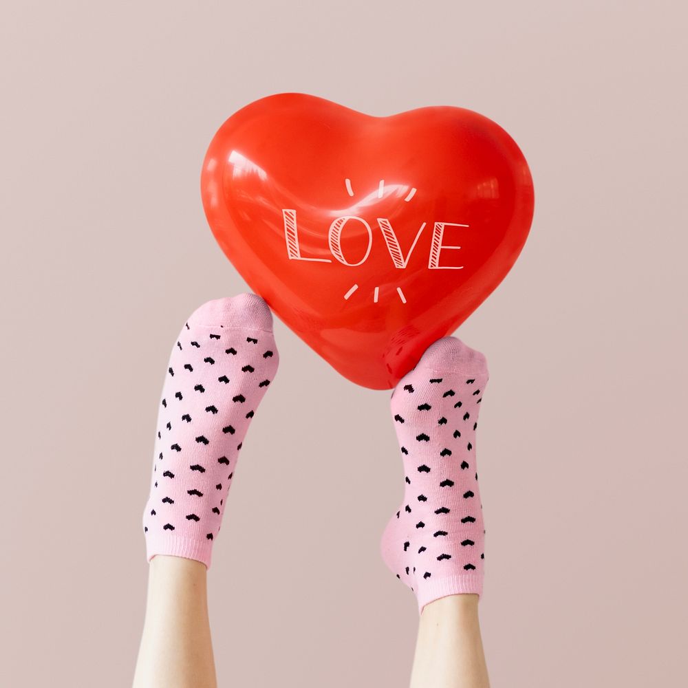Heart balloon on a feet with socks psd mockup