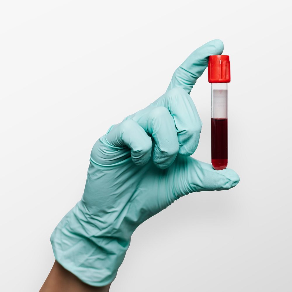 Hand holding a blood test tube mockup