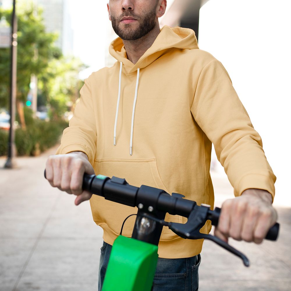 Man in a yellow hoodie on a scooter men&rsquo;s shirt fashion apparel street shoot