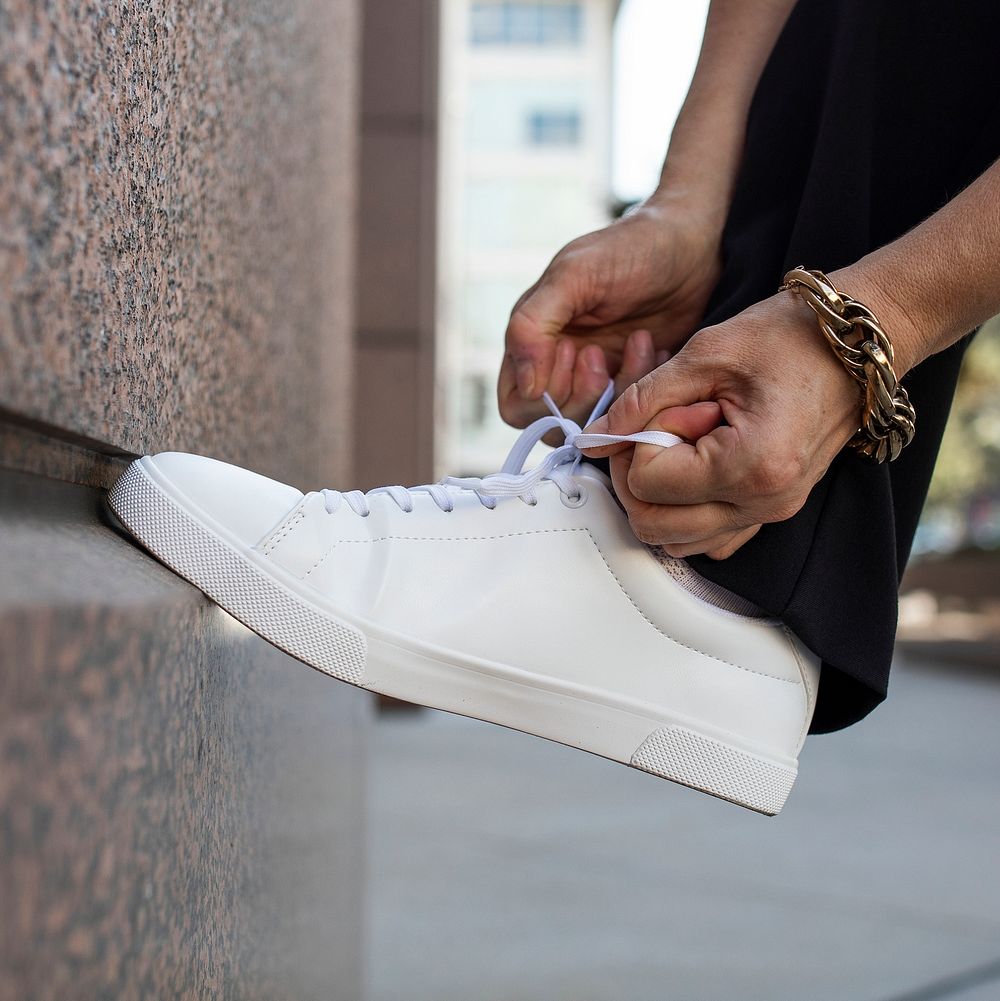 Canvas sneakers mockup white psd model tying shoelaces apparel ad