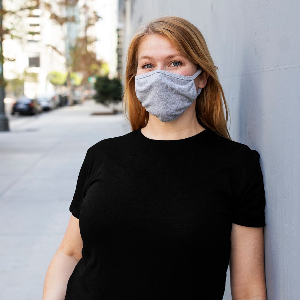 Blonde woman wearing mask psd in the city outdoor photoshoot