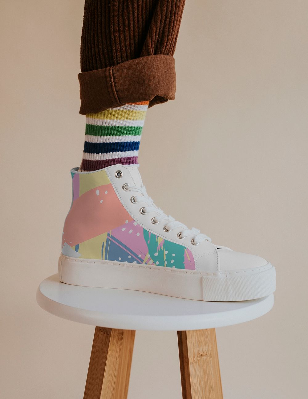 Model in sneakers mockup standing on chair