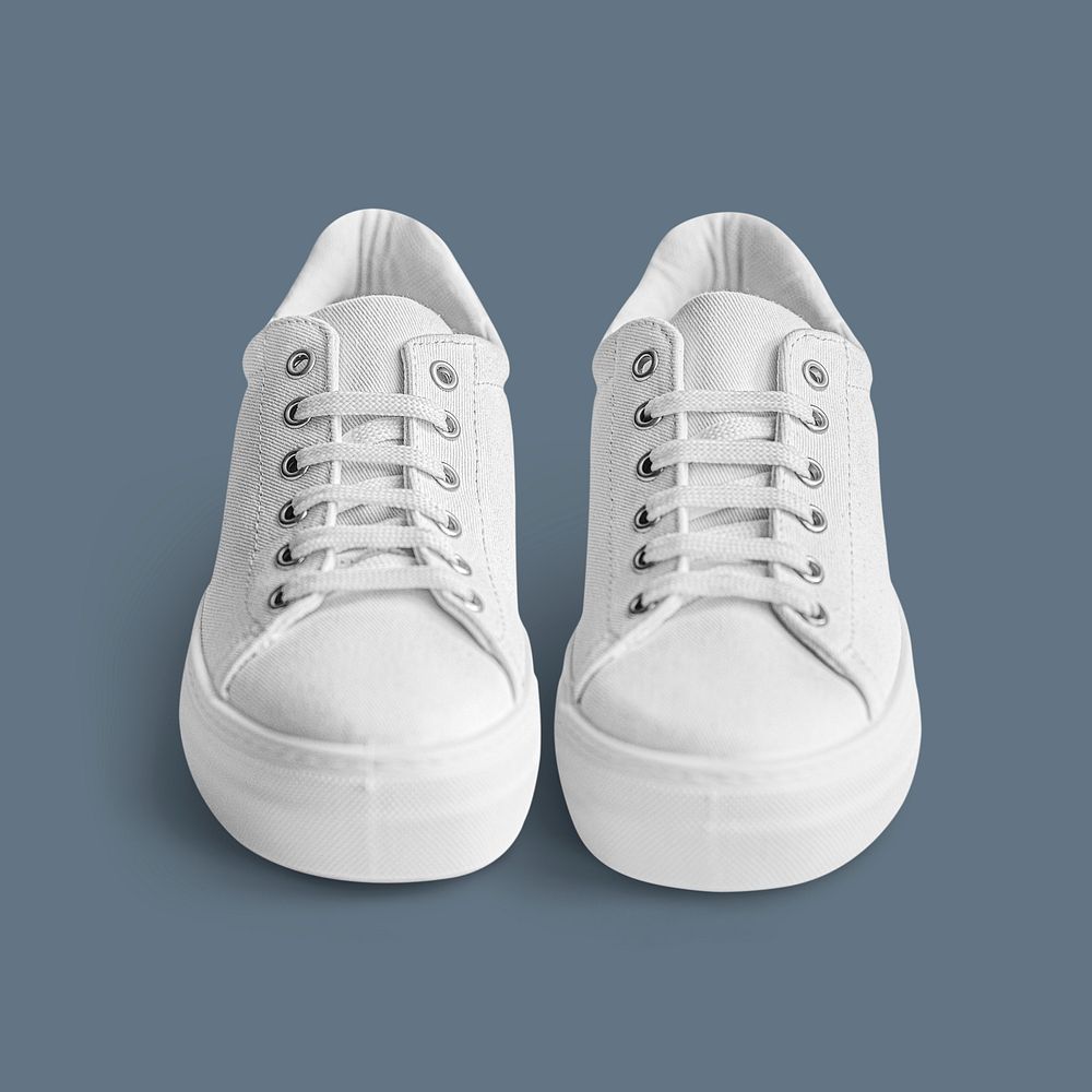 Psd white canvas sneakers mockup on blue
