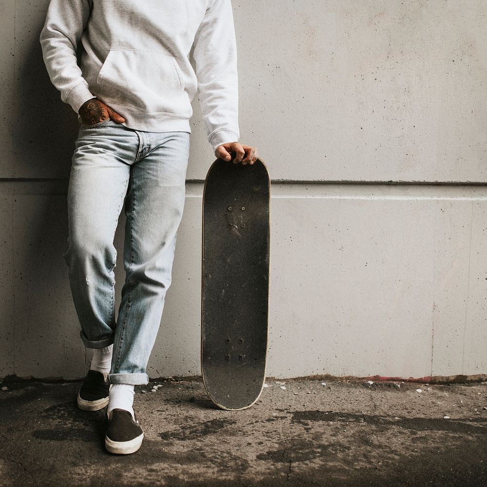Streetwear fashion man with a skateboard 