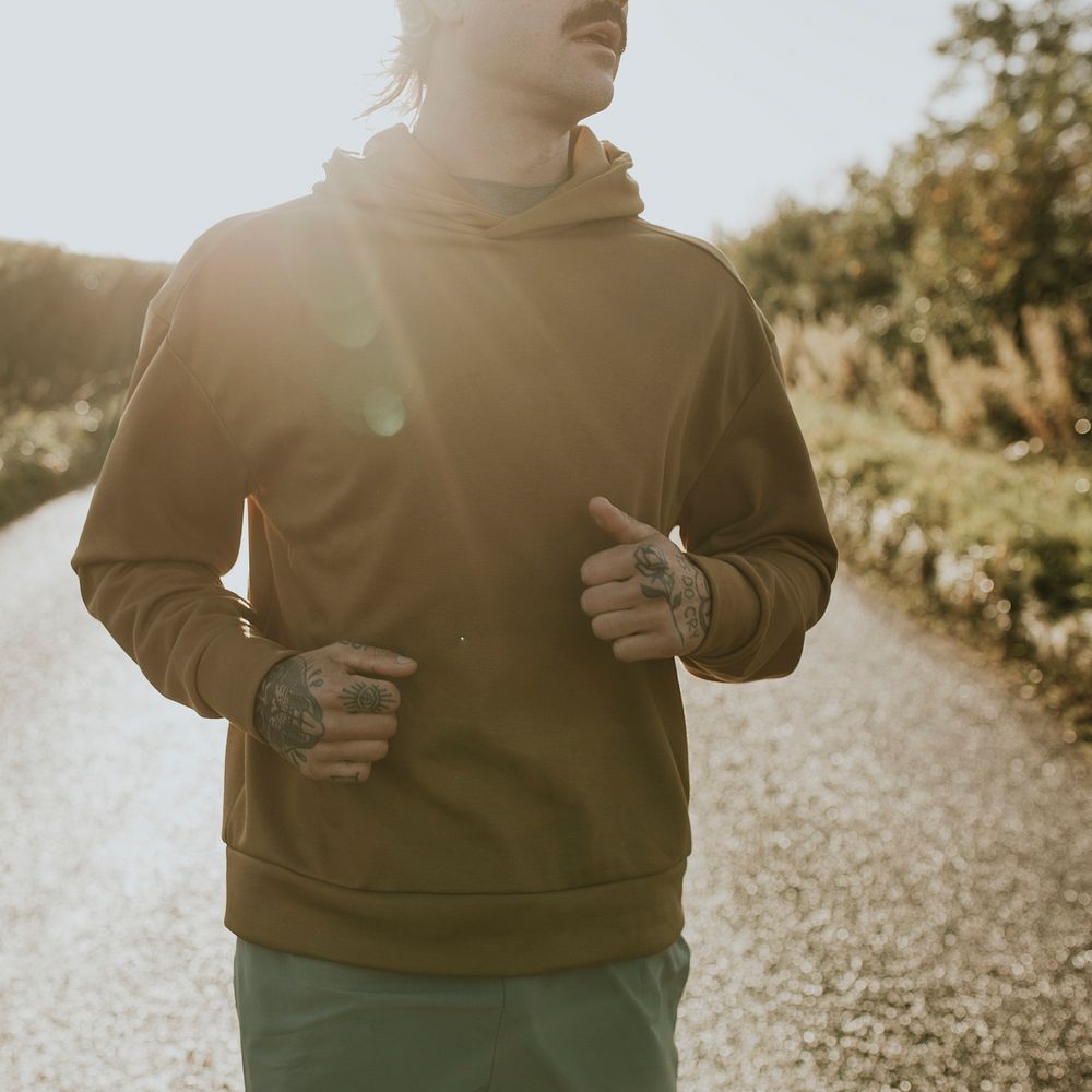 Hoodie mockup psd with man running outdoors