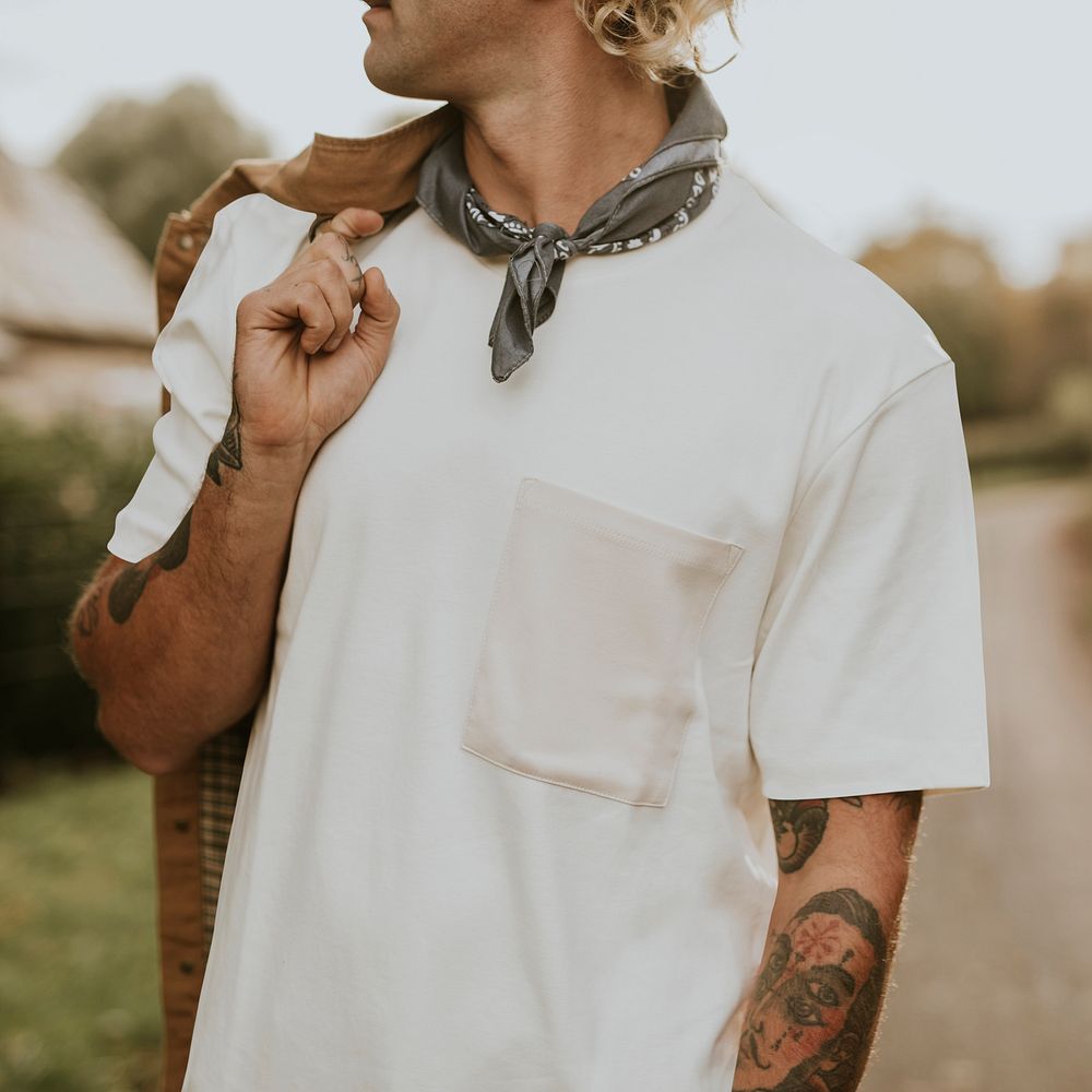 Man with mustache wearing white t-shirt with design space