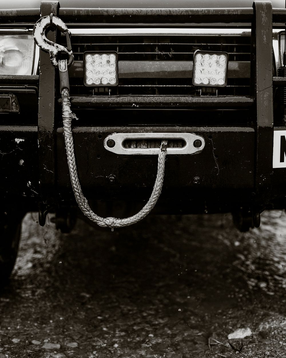 Towing cable hanging on a car front 