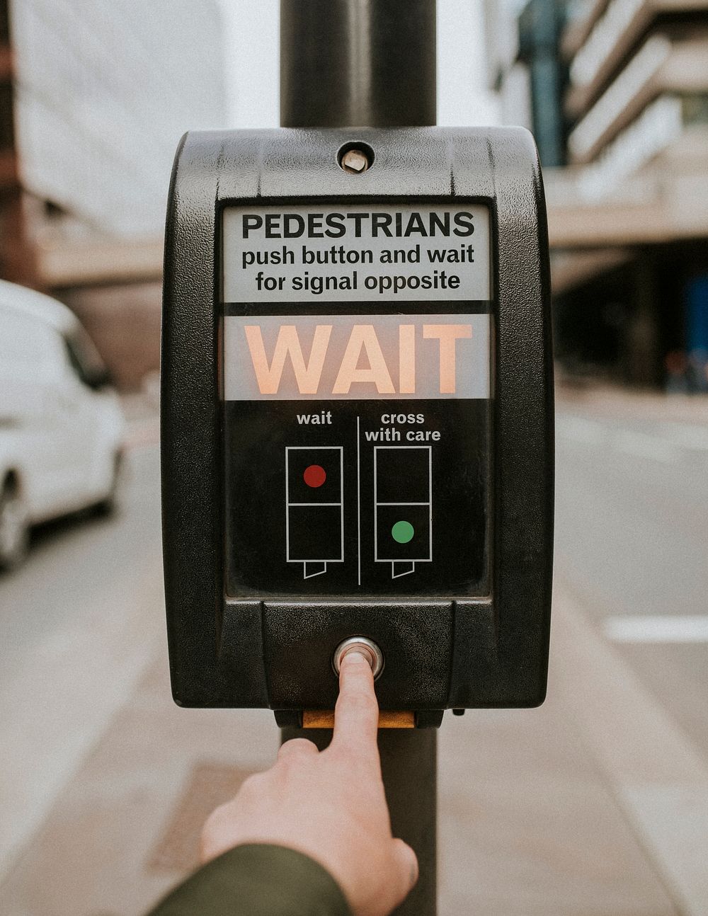 Person pressing a pedestrian cross push button 