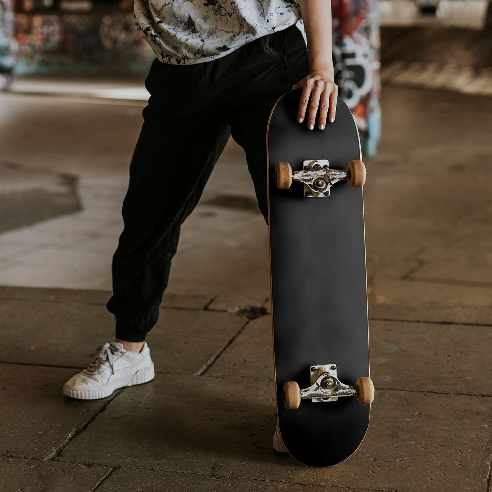 Cool skater with black skateboard