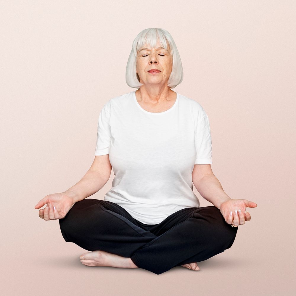 Senior woman meditating, full lotus pose psd