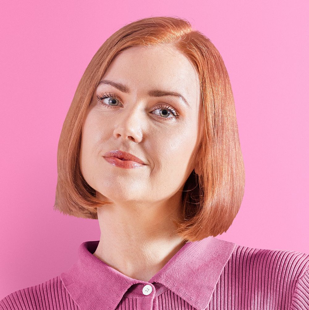 Ginger-haired woman in pink shirt portrait psd