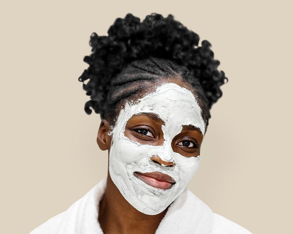 Spa facial mask on African American woman