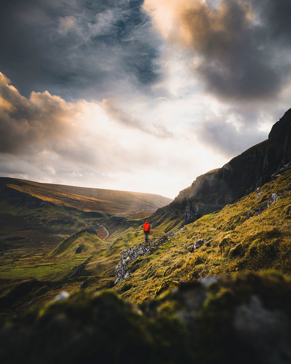 Man walking on the slope of Quiraing, Scotland