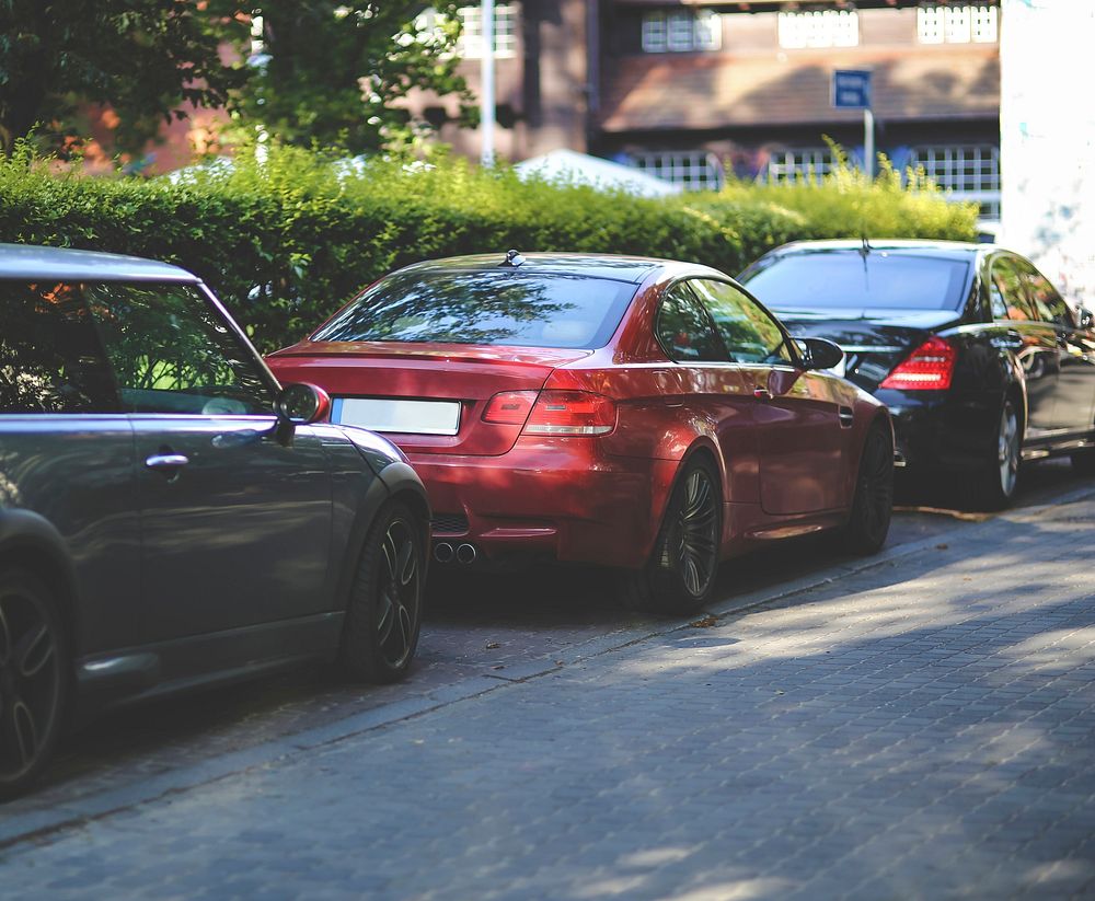 Cars parked along a street. Visit Kaboompics for more free images.