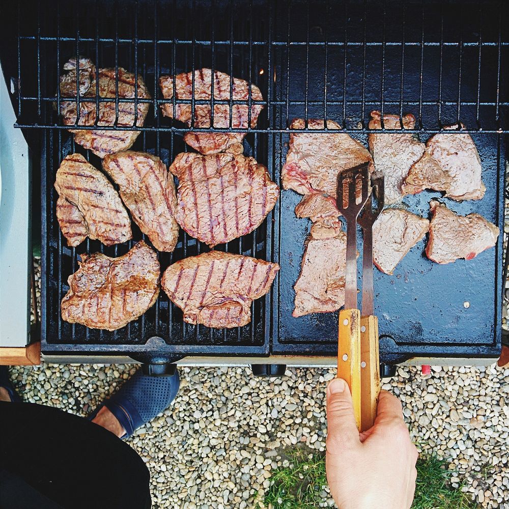 A pork steaks barbeque on a grill