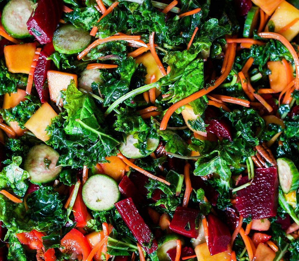 Colorful salad with beet, carrot, zucchini and leafy green