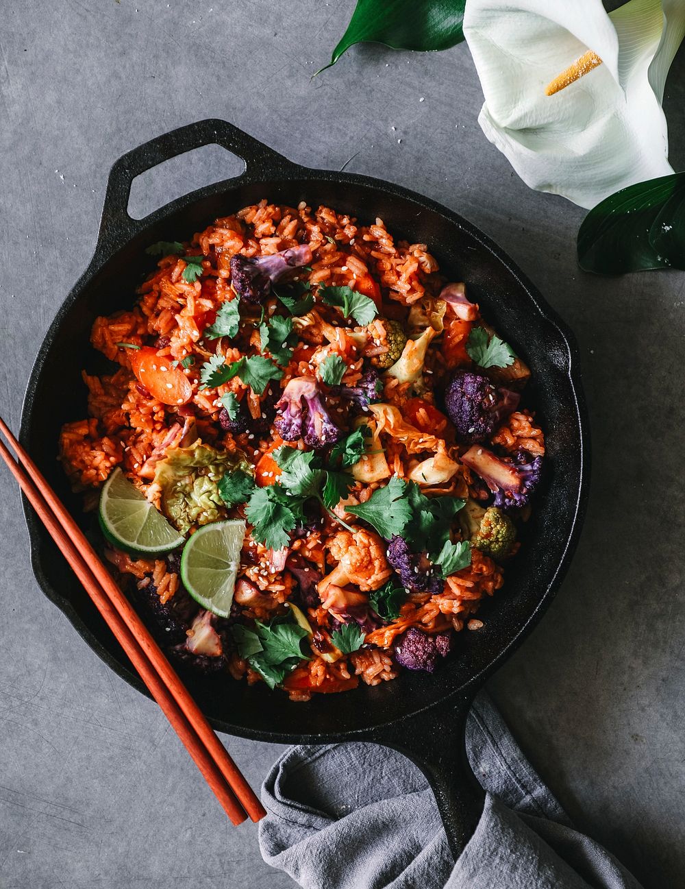Kimchi fried rice with cilantro, sesame seeds, black pepper, and lime juice