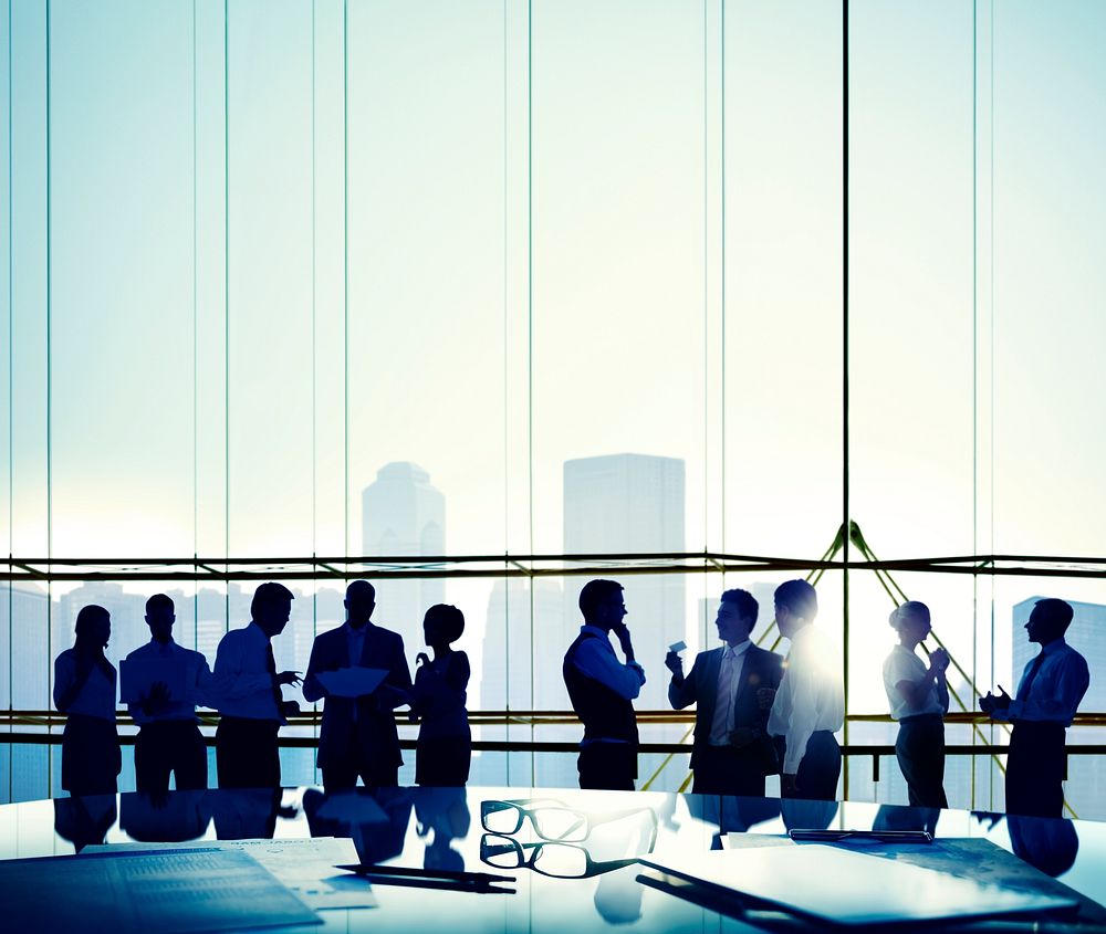 Silhouette of business people communicating in the workplace