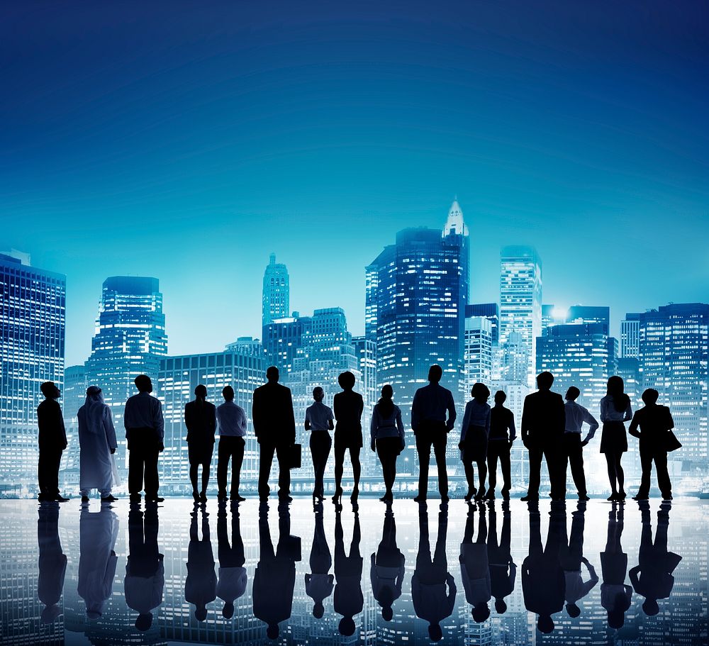 Business people standing silhouette on city buildings background
