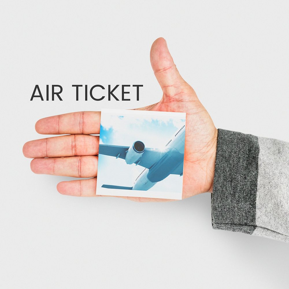 hand holding banner with illustration of air ticket booking for travel destination