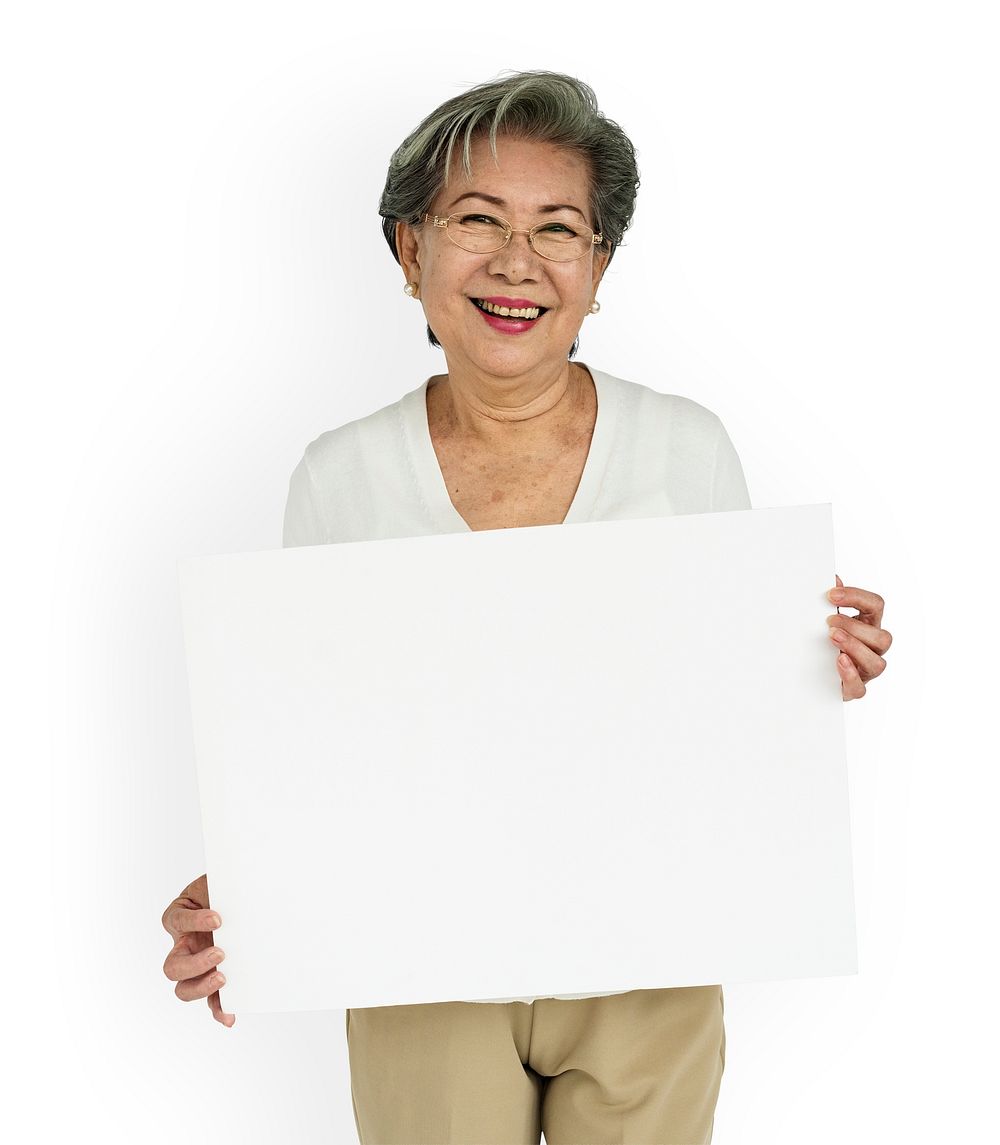 Senior lady holding a blank placard
