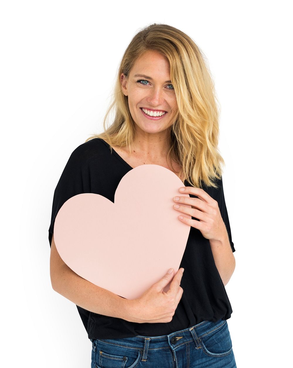 Caucasian woman holding a heart 