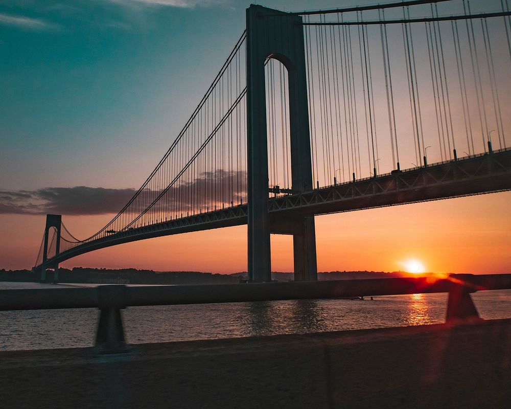 Free long double-decker suspension bridge connects Staten Island to Brooklyn in New York City at dusk image, public domain…