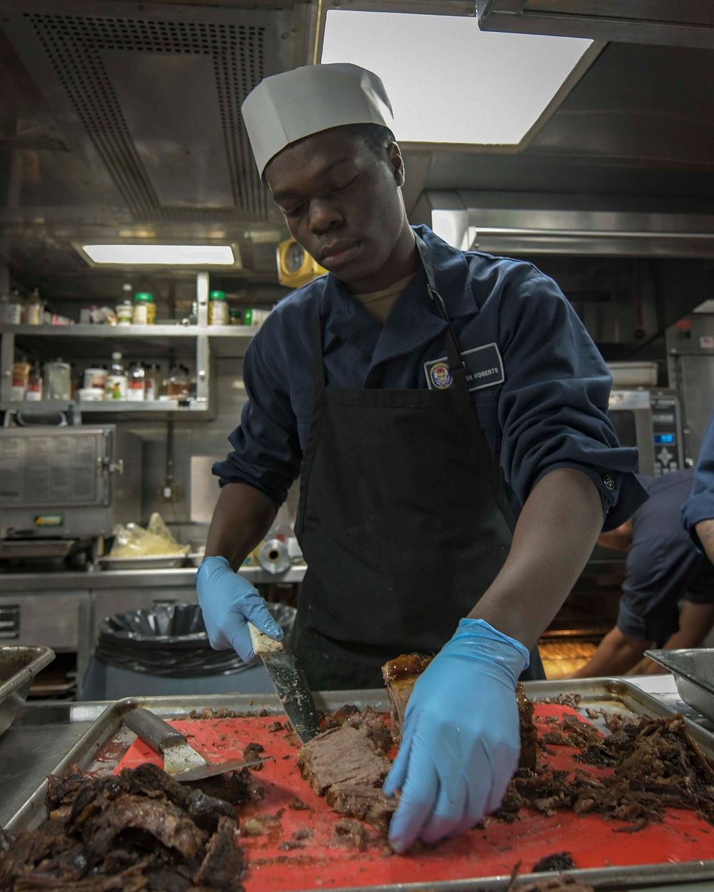 ATLANTIC OCEAN (May 19, 2019) &ndash; Culinary Specialist Seaman Cameron Roberts prepares a roast in the galley of the…