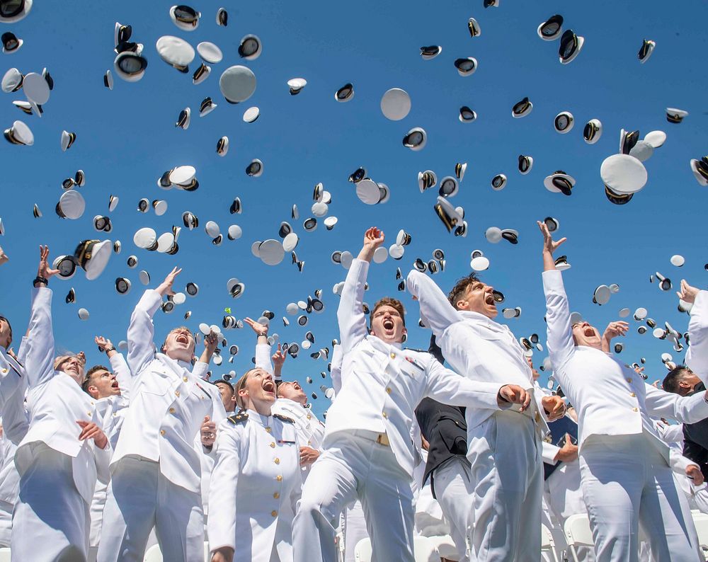 Midshipmen toss their covers in the air during the United States Naval Academy's Class of 2019 Graduation Day and…