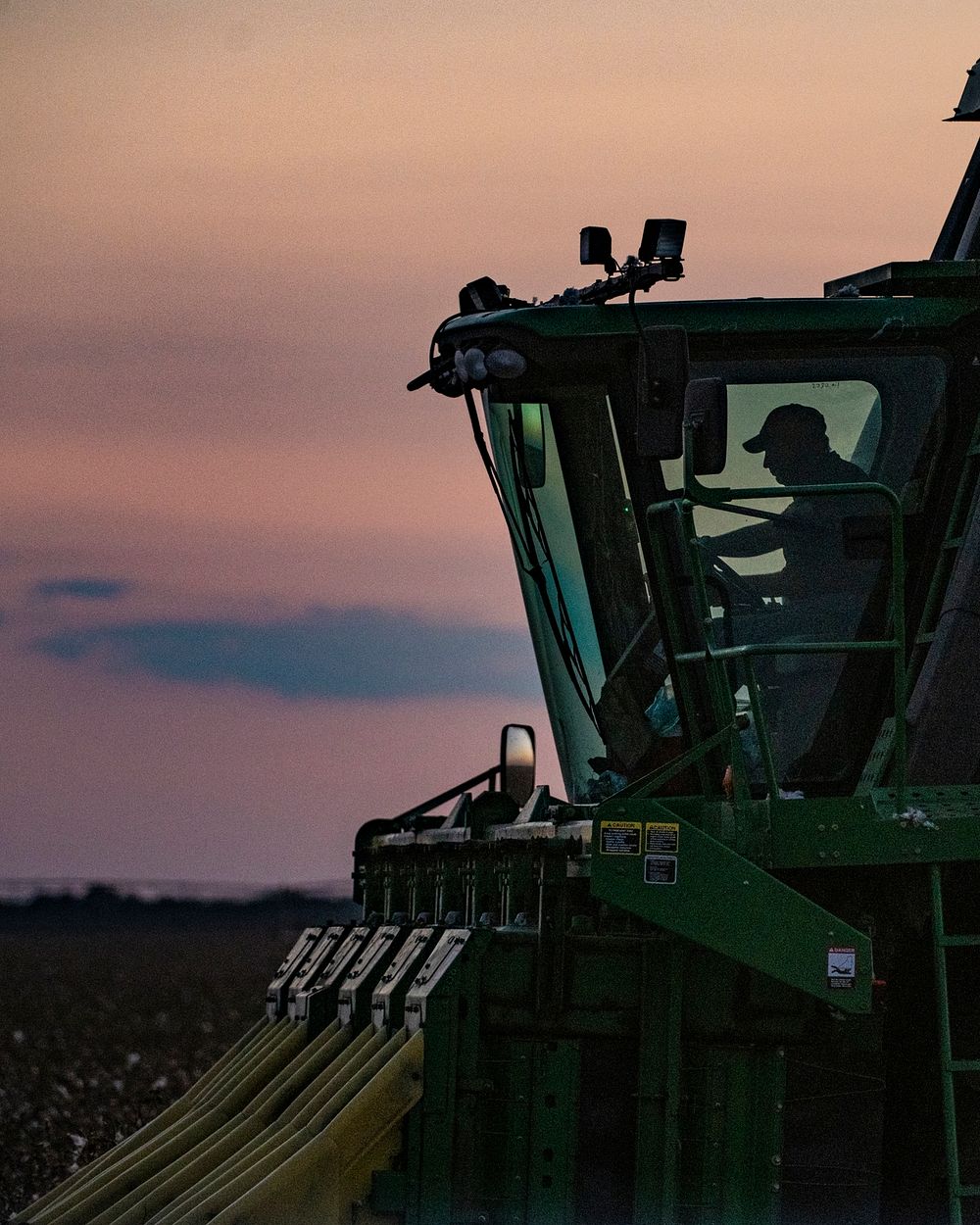 Sunset does not stop the harvest operation; lights come on and GPS will guide the harvester along the rows, during the Ernie…