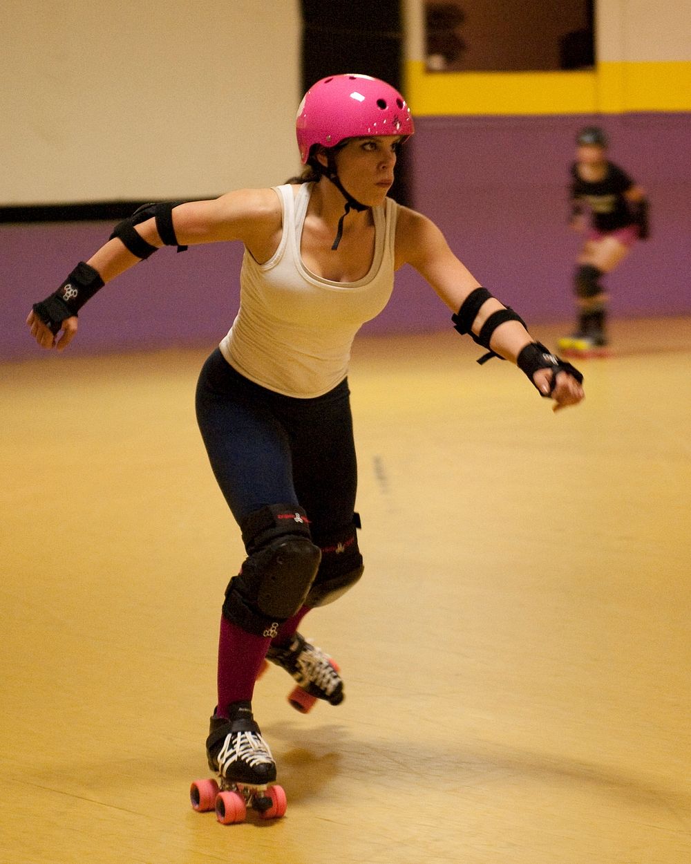 Petty Officer 3rd Class Destinee Winslow skates Sunday, May 1, 2011, during a roller derby practice in Groton, Conn. Winslow…