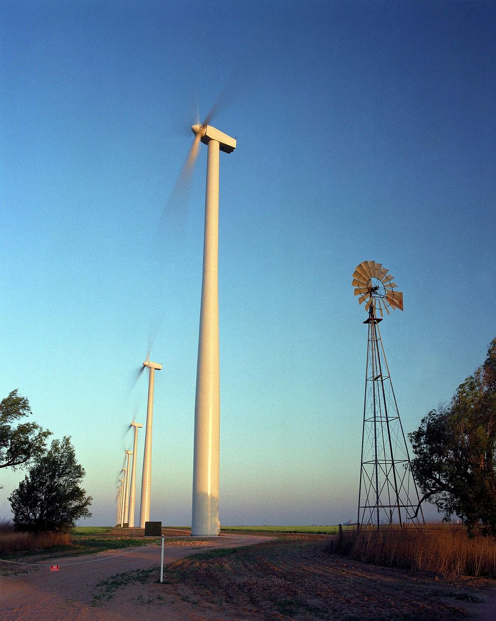 Wind farm in Kansas during sunrise. Original public domain image from Flickr