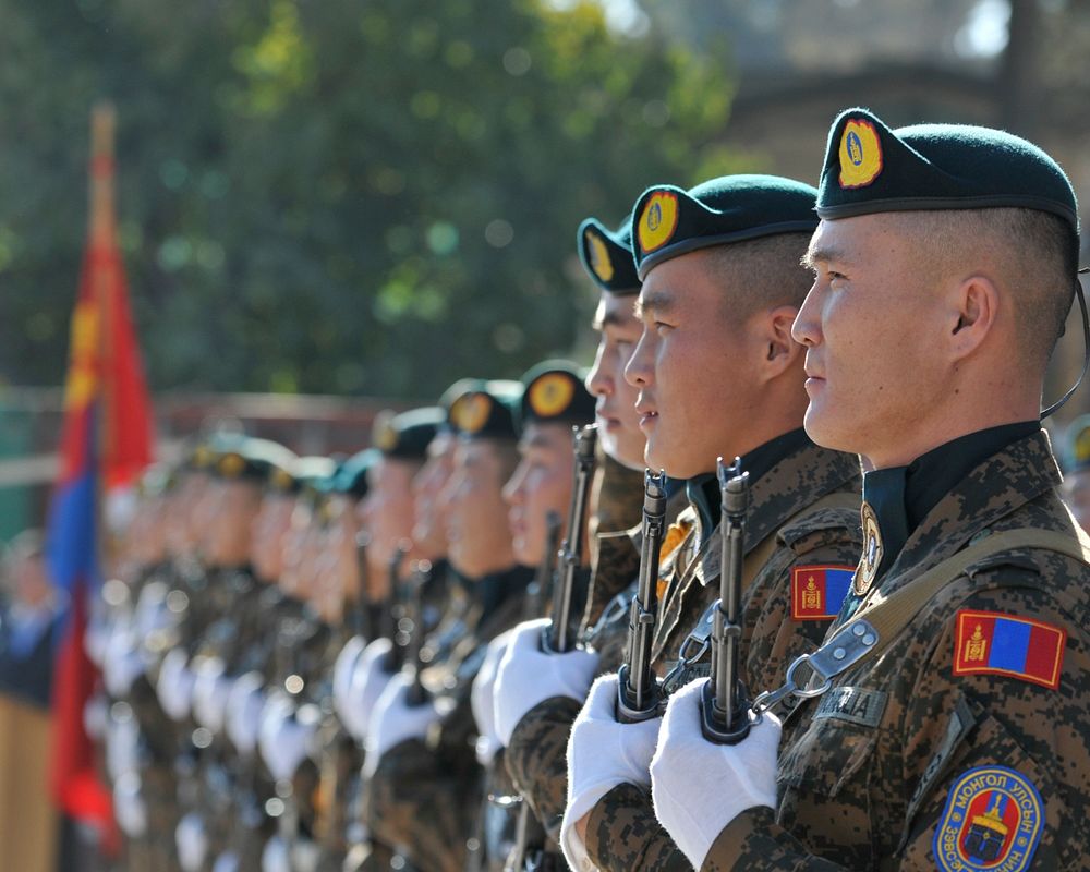Mongolian soldiers attached to the Mongolian contingent of the International Security Assistance Force stand in formation…