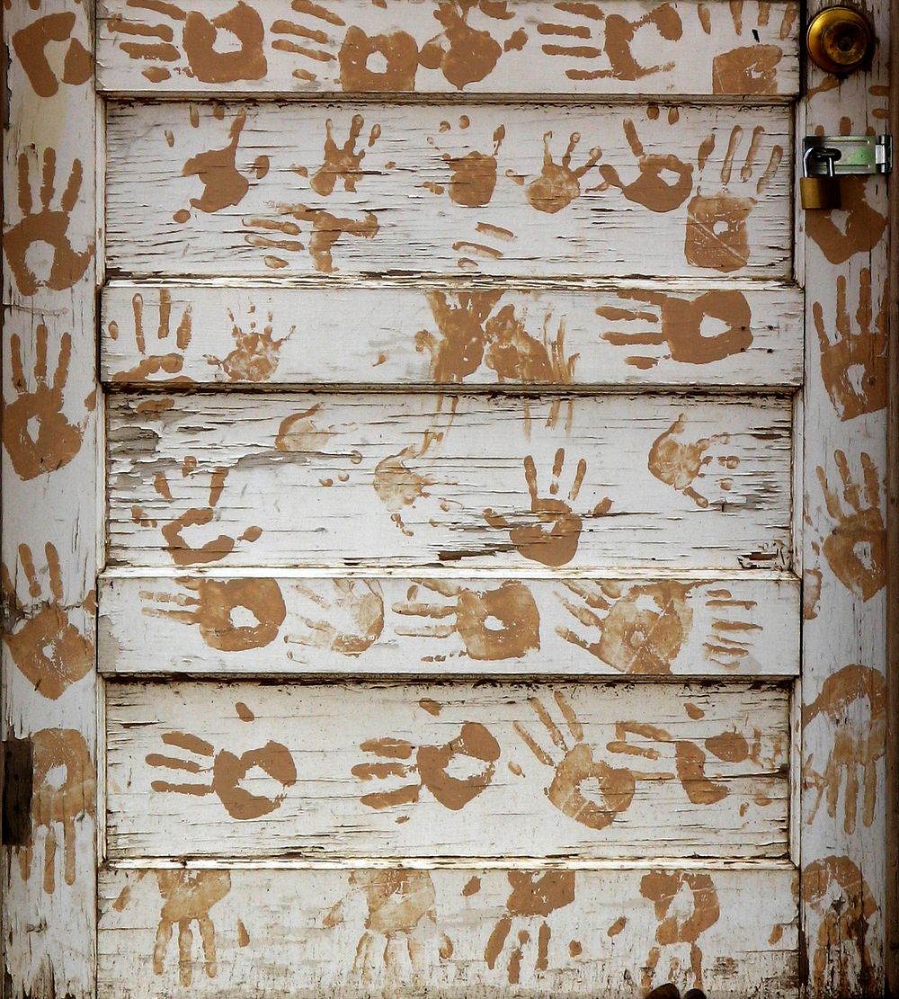 Hand prints on wooden wall. Free public domain CC0 photo.