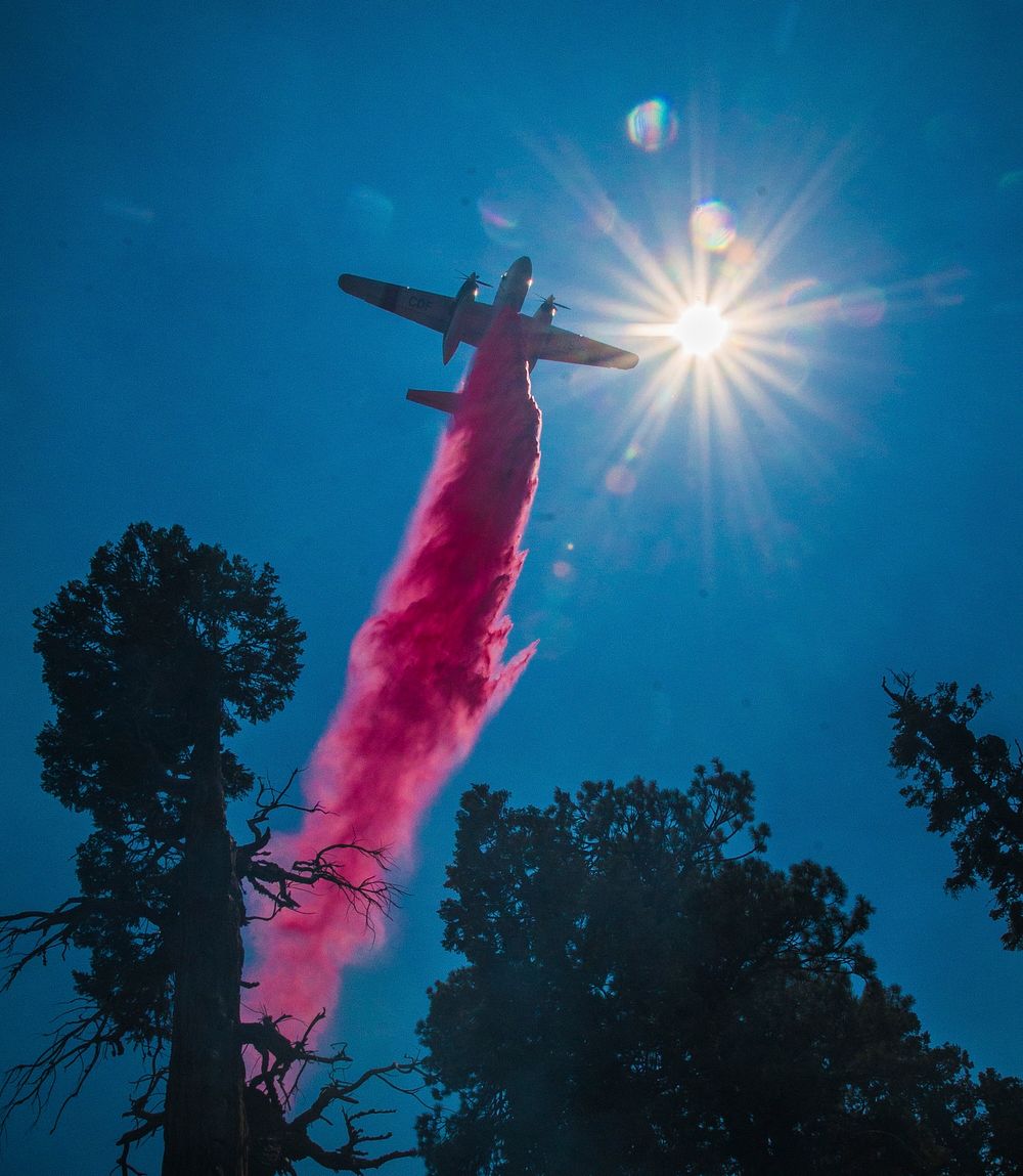 Cedar Fire operations include air dropped fire retardant on Black Mountain in the U.S. Department of Agriculture (USDA)…